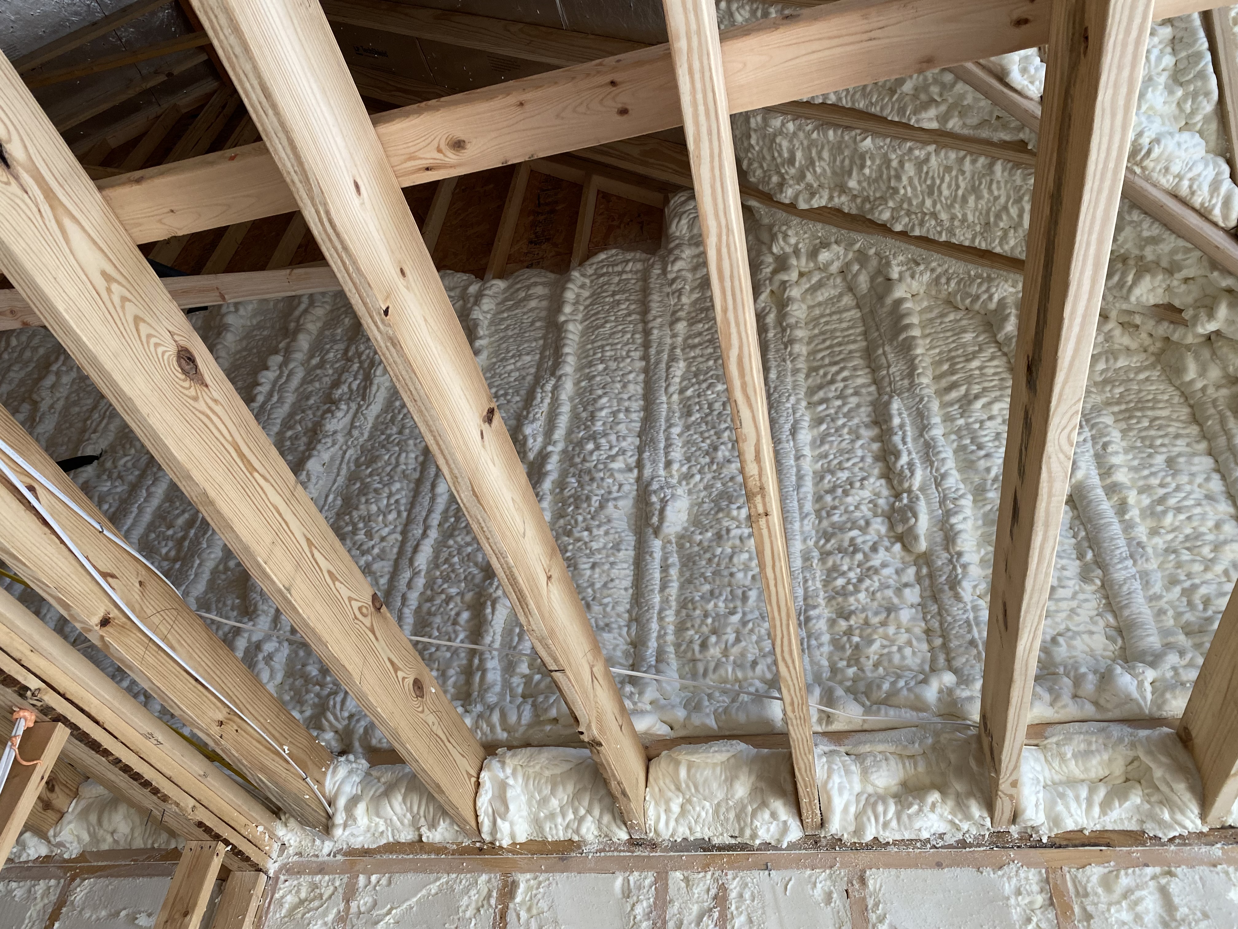 Spray foam insulating rim joist area