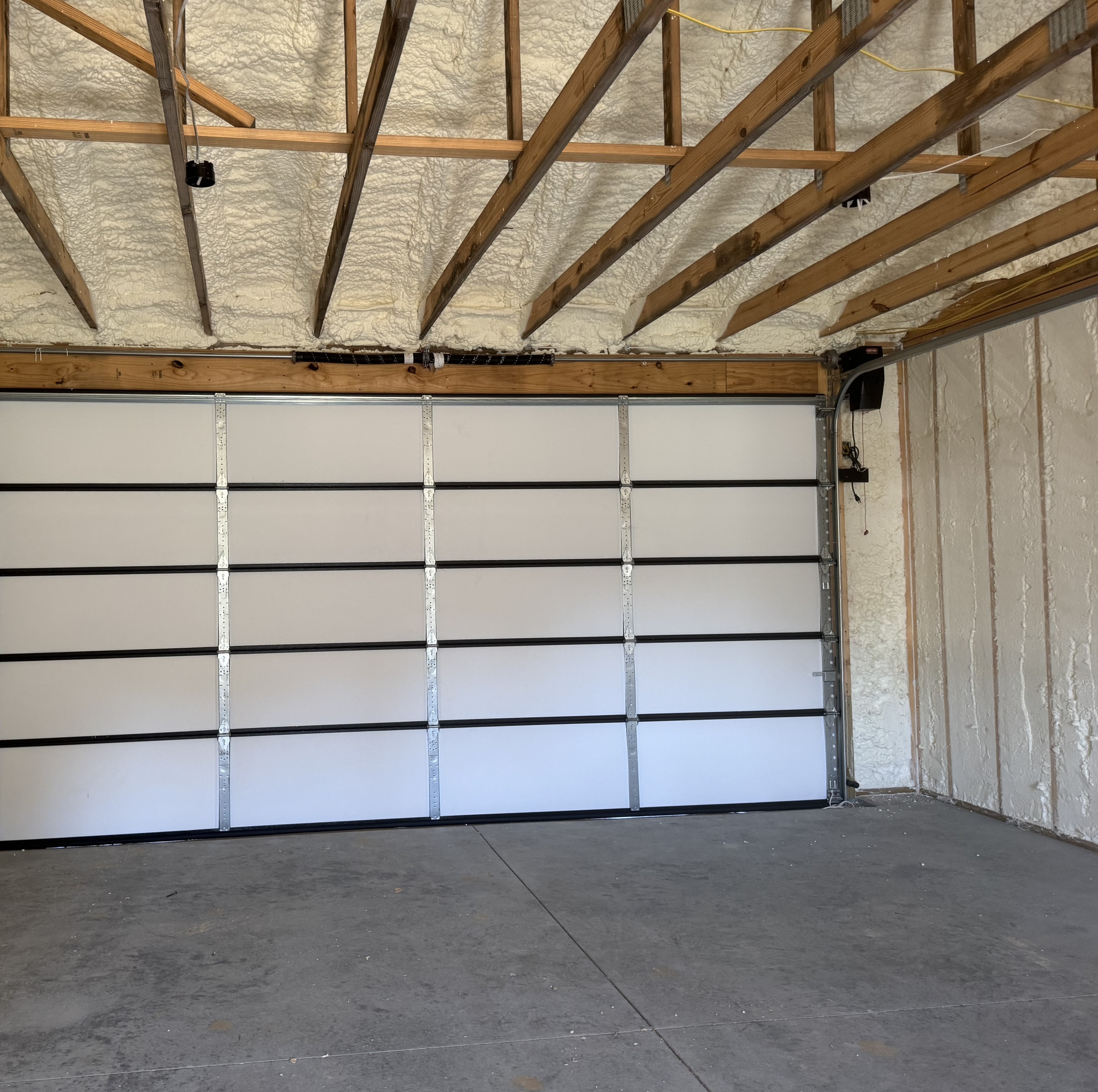 Insulation team spraying foam on a commercial project