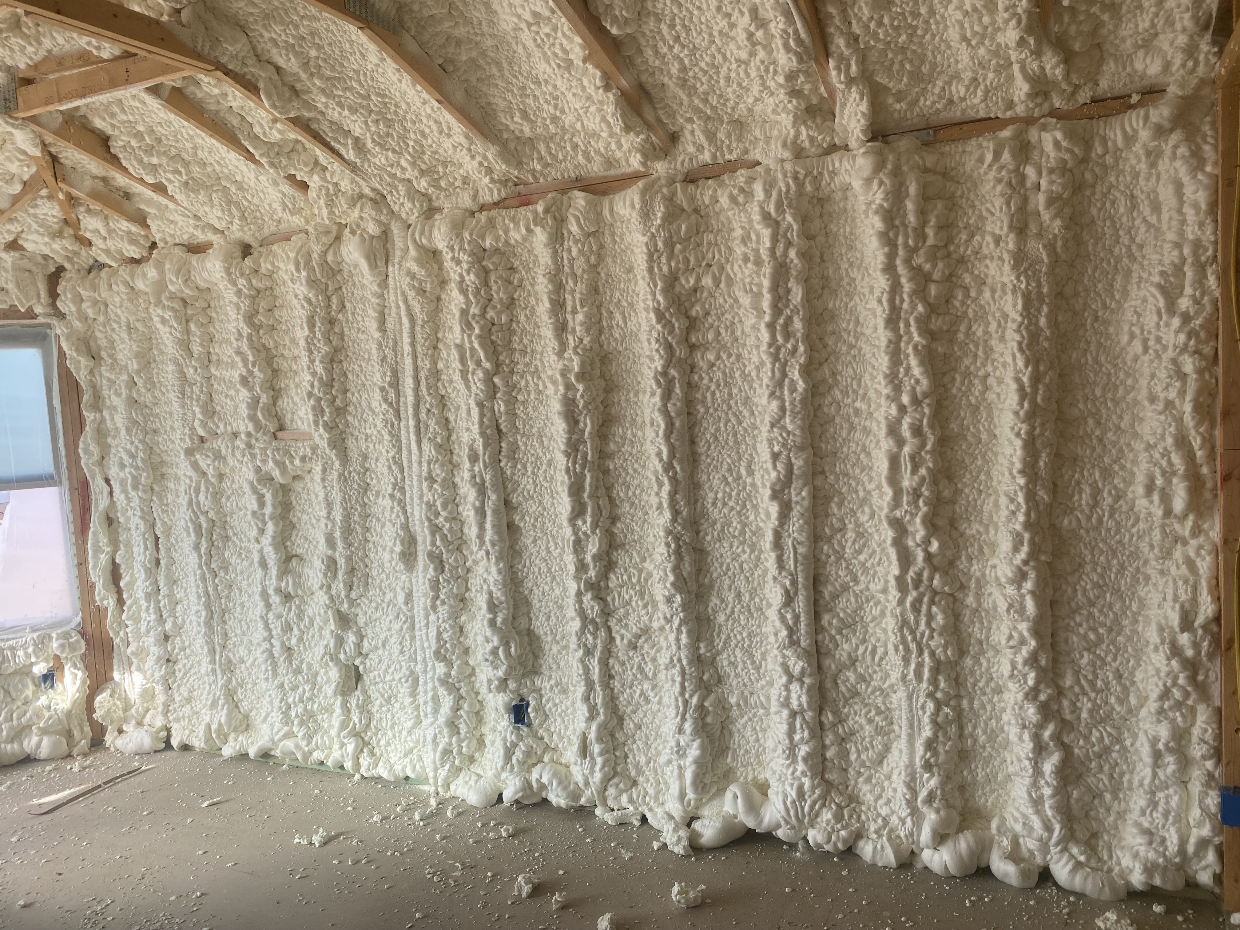 Spray foam covering gable wall framing